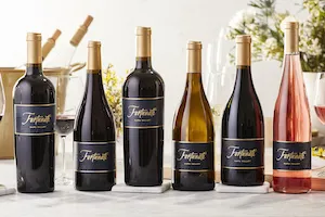 Fortunati Wine Glasses and bottles on a table