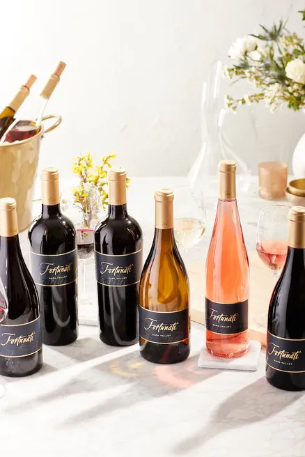 Fortunati Wine Glasses and bottles on a table