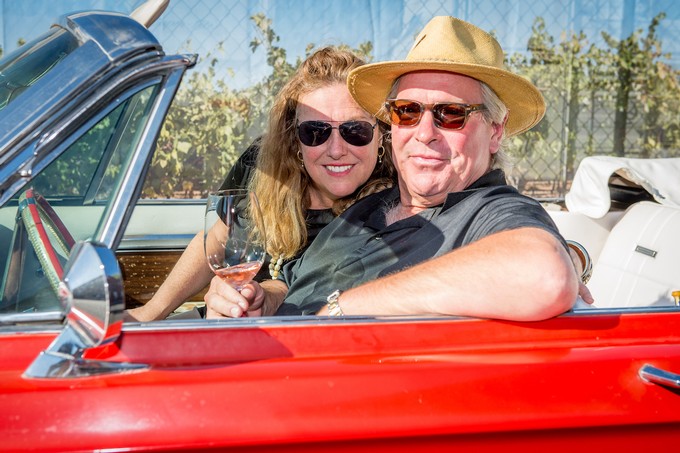 Gary and Ellen sitting in a convertible car